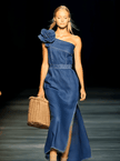 FJØRNA denim strapless maxi dress, elegant evening dress with flowing fabric and fitted bodice, shown on model.