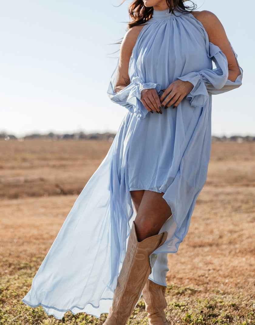 FJØRNA women's sleeveless maxi dress with halter neckline and asymmetric hem, elegant and flowy for summer occasions.