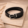 FJØRNA vegan leather ratchet belt, adjustable unisex belt with sleek design and metal buckle, suitable for casual and formal wear