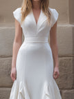 FJØRNA white ruffled hem V-neck midi dress featuring a black ruffle hem, elegant and flowy dress for women.