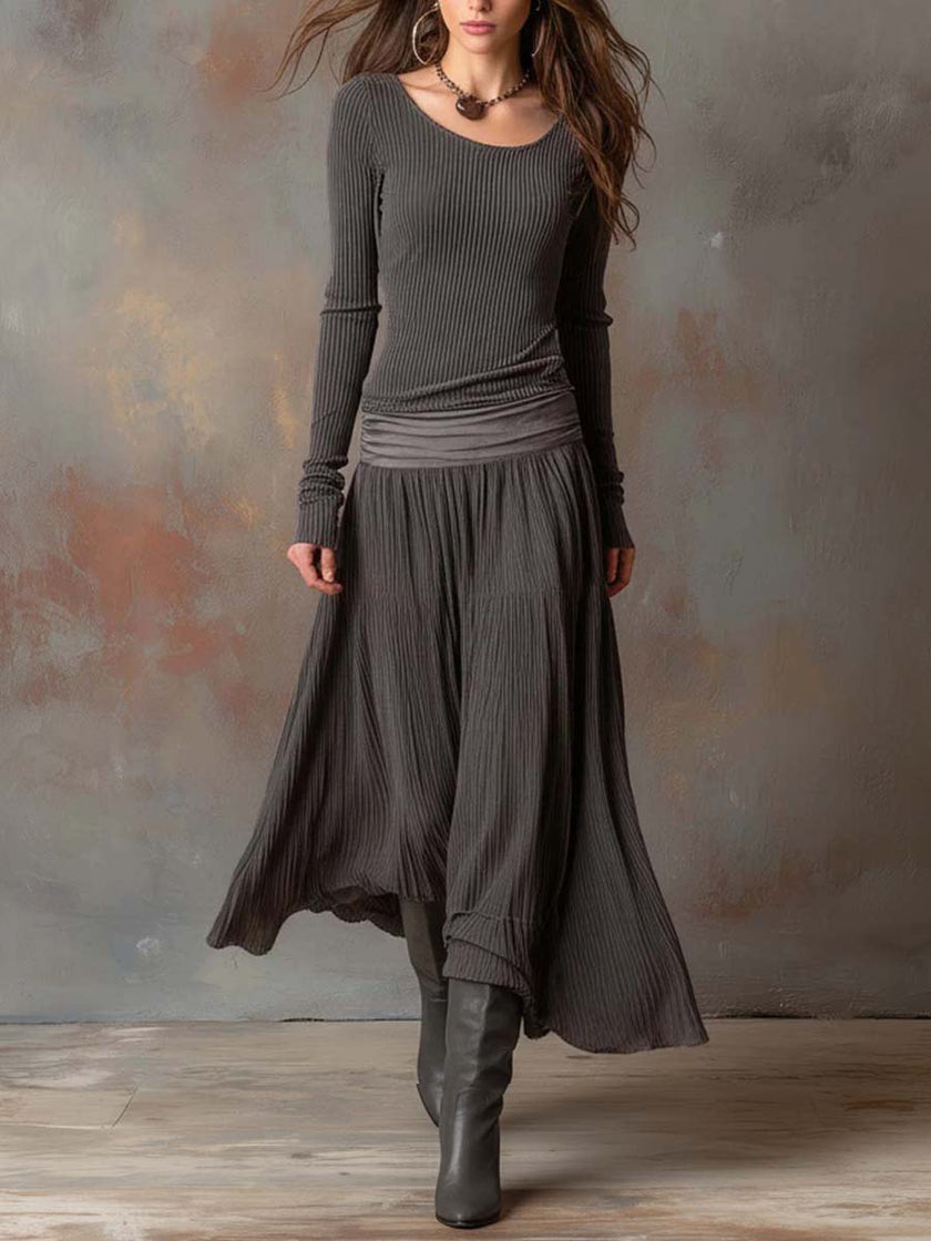Charcoal knit maxi dress for women by FJØRNA, featuring a flowing silhouette and long sleeves, perfect for casual or dressy occasions.