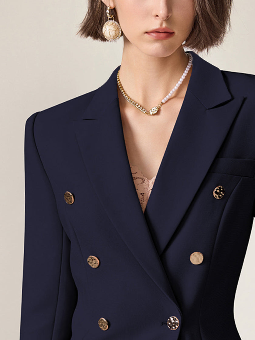 Navy lapel double-breasted two-piece suit set for women by FJØRNA, featuring tailored blazer and matching pants on a mannequin.