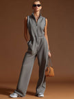 Dark grey FJØRNA women's cotton blend zip-up sleeveless jumpsuit, featuring a sleeveless design and zip-up front.