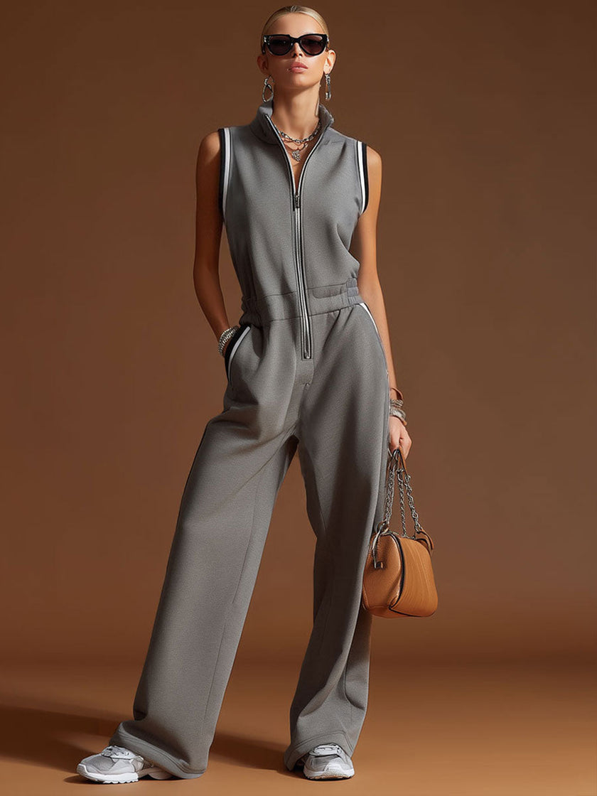 Dark grey FJØRNA women's cotton blend zip-up sleeveless jumpsuit, featuring a sleeveless design and zip-up front.