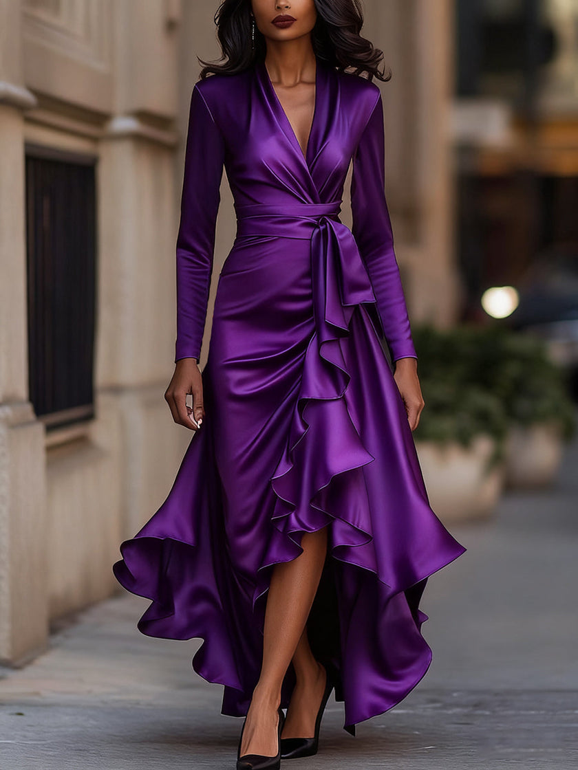 Navy blue satin maxi dress with draped design and ruffle details by FJØRNA, featuring elegant flowing fabric and a stylish silhouette.