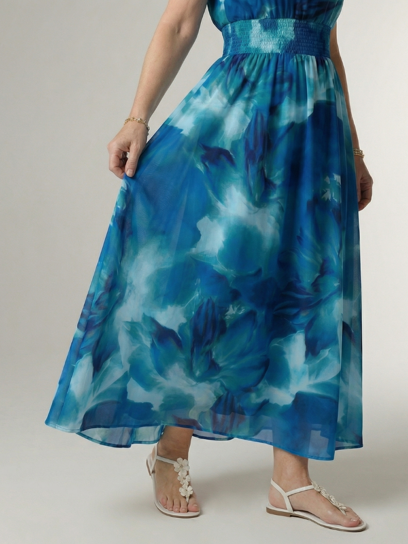 FJØRNA summer midi dress for women with halter neck, sleeveless design, flowy fabric, perfect for warm weather occasions