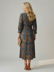FJØRNA women's summer midi dress with long sleeves and wrap design, lightweight and stylish for warm weather wear.