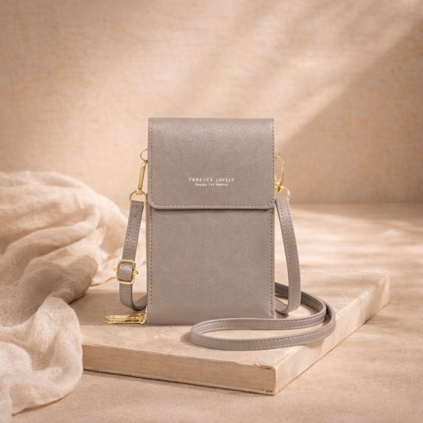 FJØRNA touchscreen crossbody phone bag for women, compact bag with transparent touchscreen window and adjustable strap.