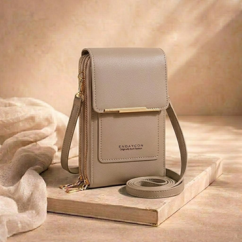 FJØRNA anti-theft crossbody bag for women, compact travel shoulder bag with secure zipper and adjustable strap.