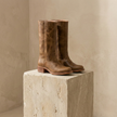 FJØRNA tan knee-high leather boots with block heels, stylish winter shoes for women, showcasing the boots' height and sleek design.