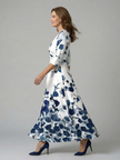 FJØRNA women's floral summer maxi dress with long sleeves, wrap style, and flowy fabric perfect for warm weather.