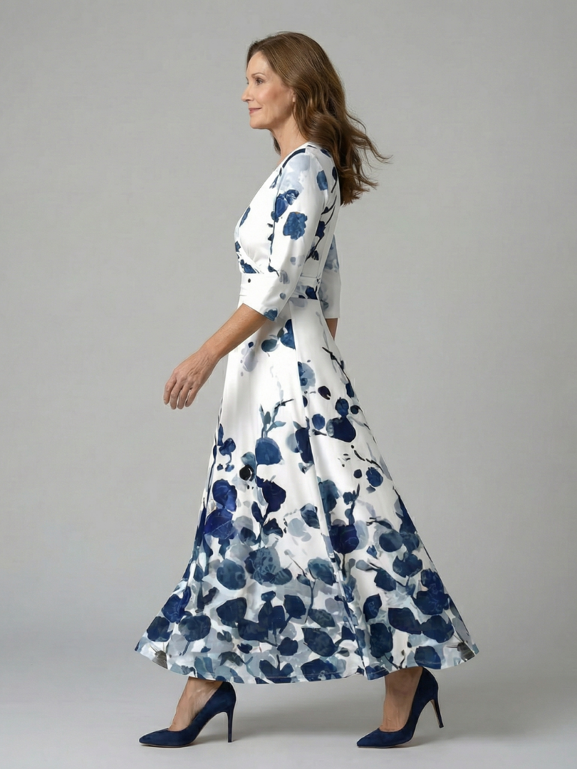 FJØRNA women's floral summer maxi dress with long sleeves, wrap style, and flowy fabric perfect for warm weather.