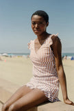 FJØRNA women's summer tankini set with ruffles and V-neck, featuring a stylish two-piece swimsuit in vibrant colors.
