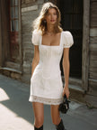 White stripe puff-sleeve mini dress for women by FJØRNA, featuring a stylish design with puffed sleeves and a fitted silhouette.