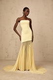 FJØRNA yellow off-shoulder sheer tulle maxi dress with flowing silhouette, perfect for elegant black tie events for women.