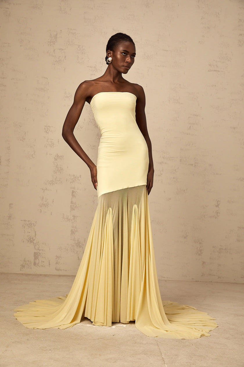 FJØRNA yellow off-shoulder sheer tulle maxi dress with flowing silhouette, perfect for elegant black tie events for women.