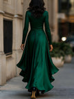 Navy blue satin maxi dress with draped design and ruffle details by FJØRNA, shown on a model.