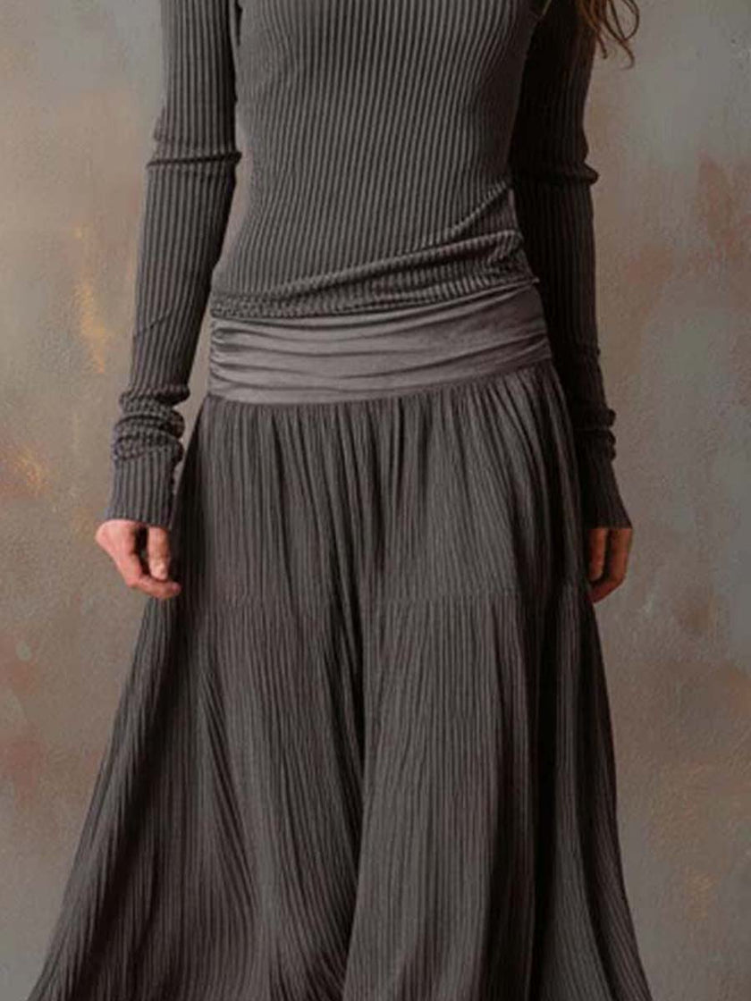 Charcoal knit maxi dress for women by FJØRNA, featuring a flowing silhouette and soft fabric.