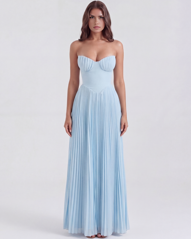 Women's strapless pleated maxi dress with corset bodice by FJØRNA, featuring flowing fabric and elegant design.