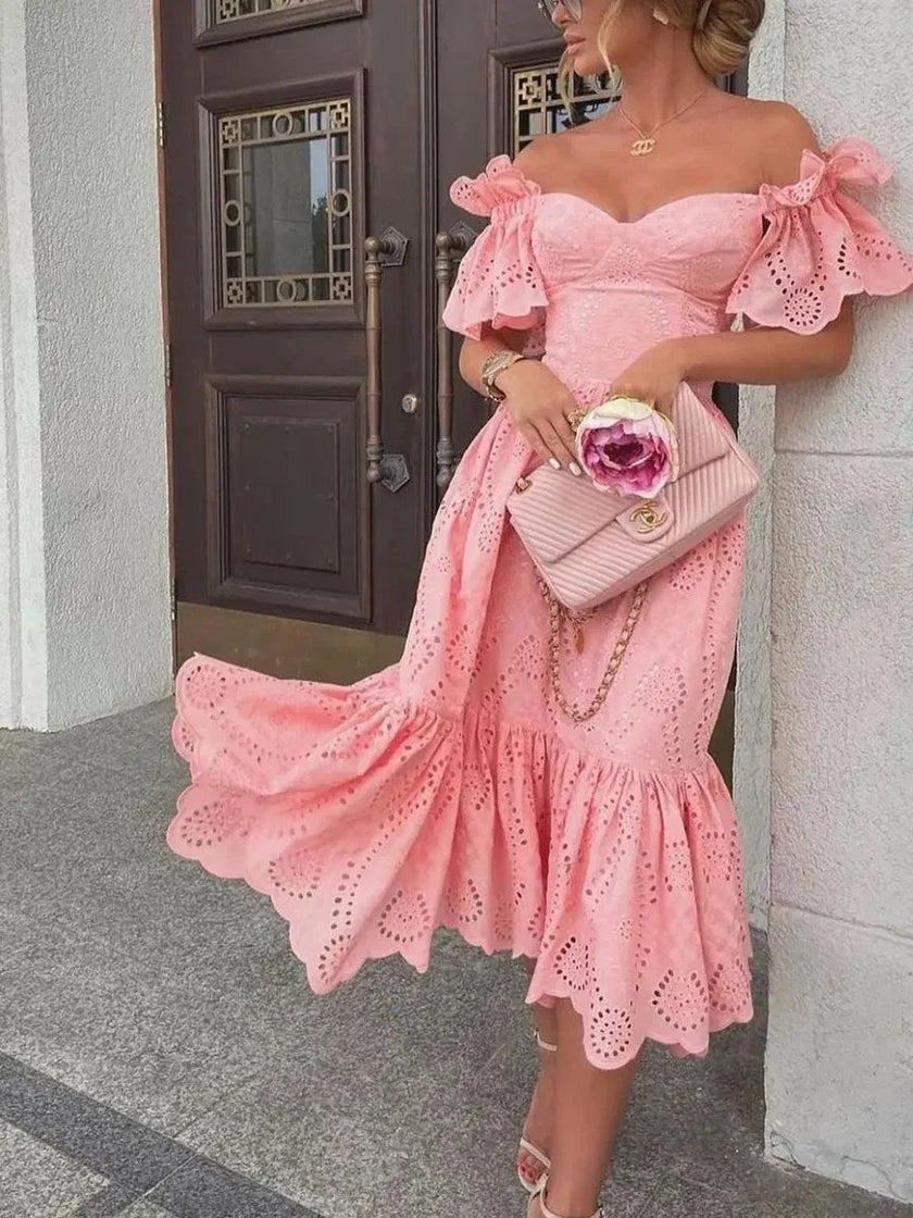 Pink FJØRNA off-shoulder midi dress for women, elegant A-line style, showcasing the flowing fabric and stylish neckline.