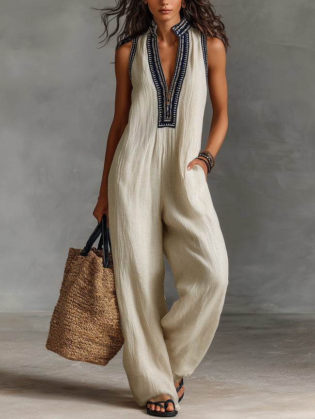 FJØRNA linen blend sleeveless jumpsuit for women with stand collar and embroidery details, featuring stylish pant design.