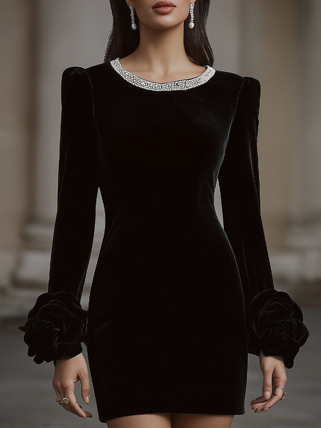 FJØRNA elegant velvet mini dress with embellished neckline and floral cuff detail, perfect for stylish women.