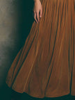 FJØRNA caramel satin spaghetti strap maxi dress, elegant wedding guest dress with flowing silhouette and delicate straps.