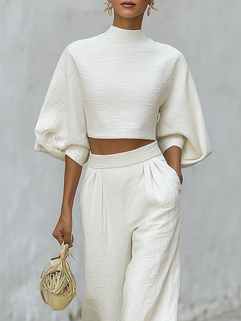 Cream textured lantern sleeve two-piece set with pants for women by FJØRNA, shown on a model.