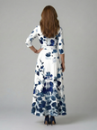 FJØRNA floral summer maxi dress for women with long sleeves, wrap style, flowy fabric, perfect for warm weather occasions.