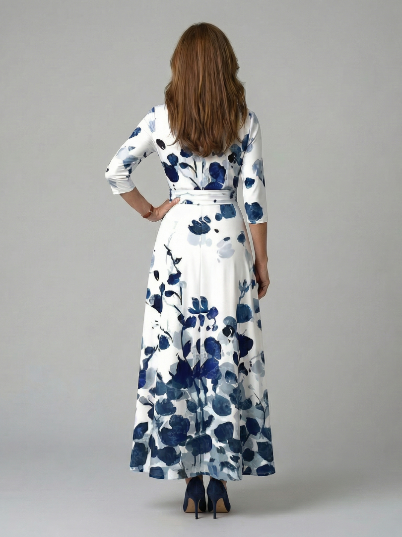 FJØRNA floral summer maxi dress for women with long sleeves, wrap style, flowy fabric, perfect for warm weather occasions.