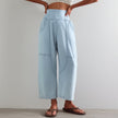 FJØRNA women's wide-leg denim trousers, casual pants with a relaxed fit, shown in a classic blue denim fabric.