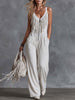 White faux suede western fringe V-neck jumpsuit for women, featuring stylish fringe and a V-neck design.
