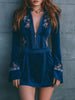 Blue velvet embroidered mini dress by FJØRNA featuring intricate embroidery and a casual fit, shown on a model.