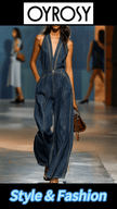 Dark blue denim FJØRNA women's sleeveless V-neck jumpsuit with wide-leg pants, styled for a casual, modern look.