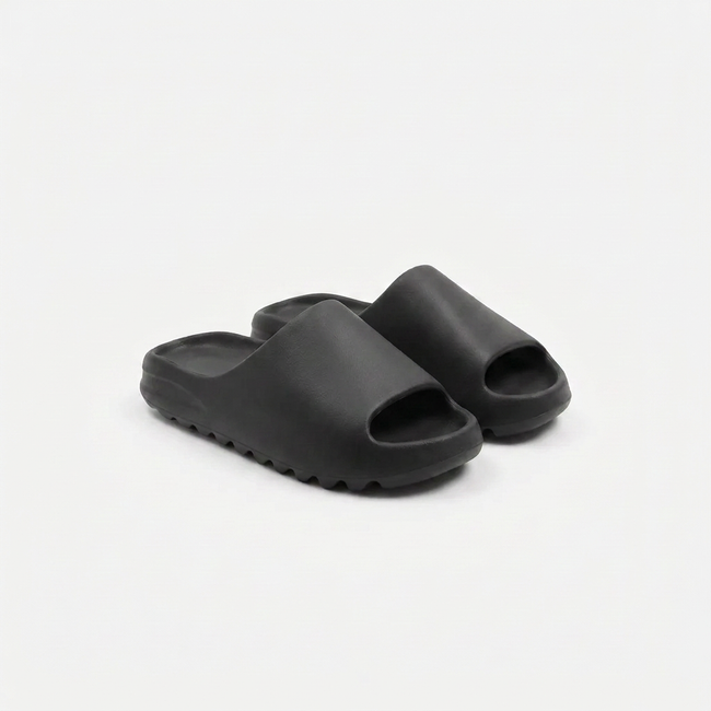 FJØRNA men's open toe slides slippers shown from an angled view, featuring a casual slip-on design and open-toe style.