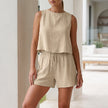 Apricot women's two-piece pleated co-ord set by FJØRNA, stylish matching top and skirt for summer wear.