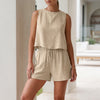 Apricot women's two-piece pleated co-ord set by FJØRNA, stylish matching top and skirt for summer wear.
