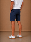 Men's FJØRNA chino shorts in smart casual cotton blend with tailored fit, shown in a relaxed, stylish look.