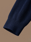 Men's breathable knit cardigan sweater by FJØRNA, smart casual layer with a textured knit pattern and button front.