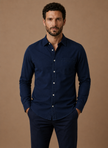 FJØRNA men's classic button-up shirt in relaxed fit, ideal for smart casual outfits, shown in a neutral color.