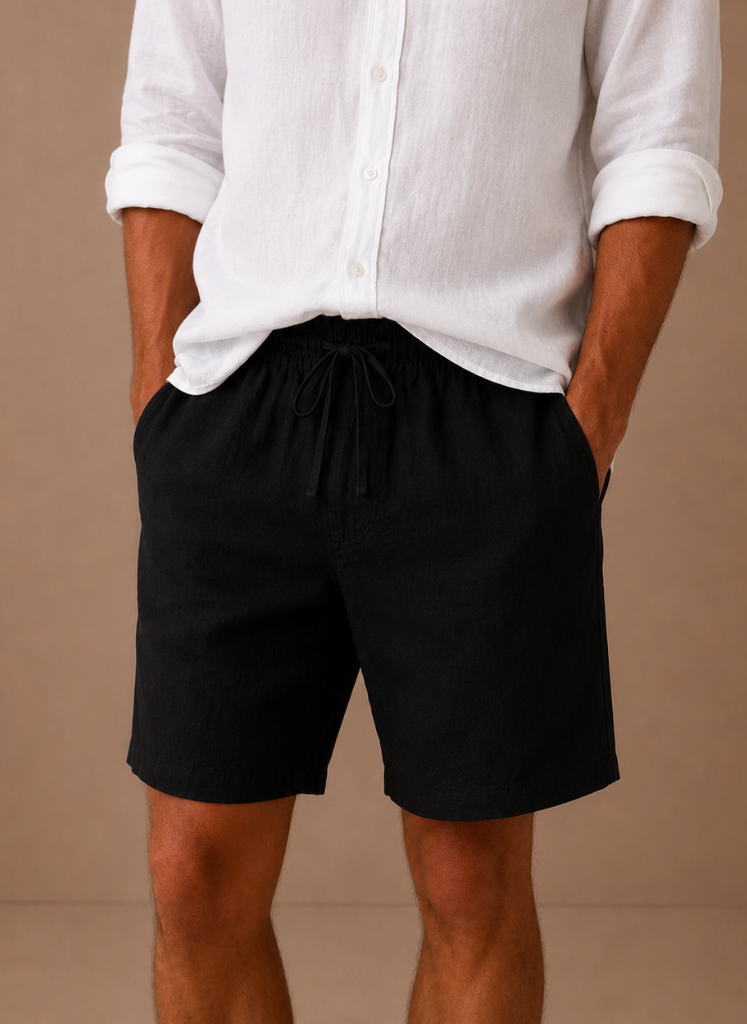 Men's cotton linen shorts by FJØRNA featuring a relaxed fit, ideal for summer, shown in a casual, comfortable style.