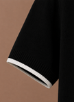 Men's slim fit polo shirt by FJØRNA with contrast trim, made of luxury cotton, showcasing a stylish and fitted design.