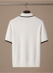 Men's slim fit polo shirt by FJØRNA with contrast trim and luxury cotton fabric, shown in a stylish, close-up view.