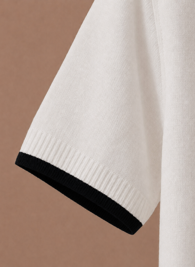 Men's slim fit polo shirt by FJØRNA featuring contrast trim and luxury cotton fabric, shown in a stylish front view.