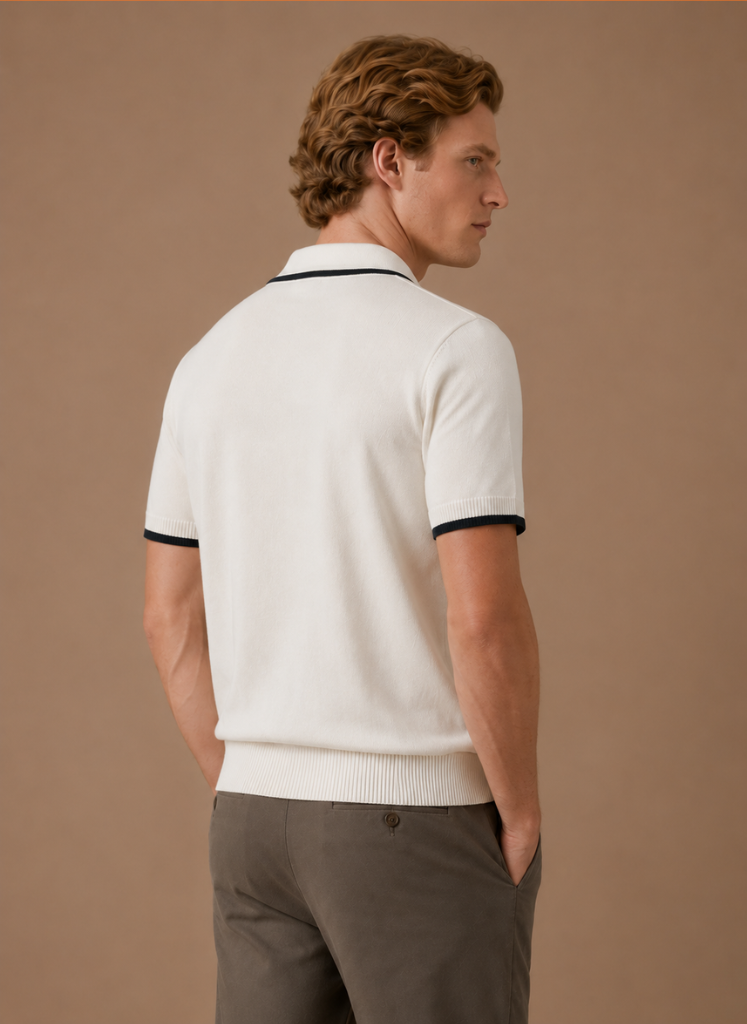 Men's slim fit polo shirt by FJØRNA with contrast trim, made of luxury cotton, shown in a stylish, close-up view.