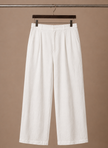Men's relaxed fit linen cotton summer trousers by FJØRNA, shown in a natural beige color, casual and comfortable for warm weather.