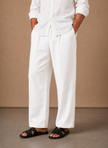 Men's relaxed fit linen cotton summer trousers by FJØRNA, shown in a natural beige color with a comfortable fit.
