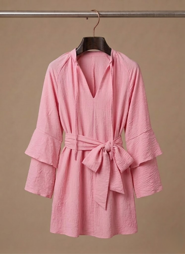 FJØRNA women's ruffle hem mini dress with long sleeves and belted waist, featuring a stylish, feminine design.