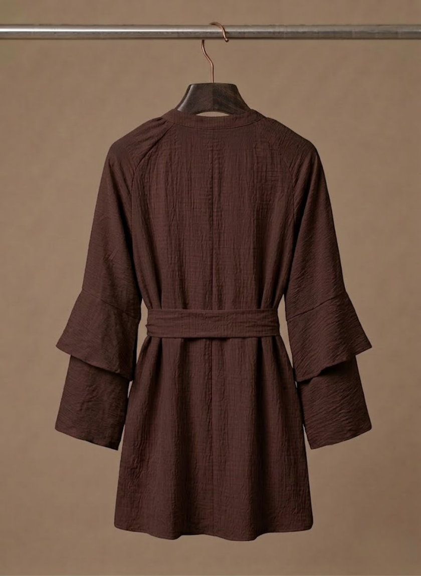 FJØRNA women's ruffle hem mini dress with long sleeves and belted waist, featuring a stylish and feminine design.
