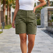 Women’s army green tailored cargo shorts with utility pockets, perfect for summer, by FJØRNA.